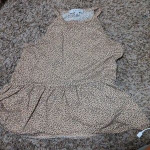 A cute tank top with a tutu looking bottom!